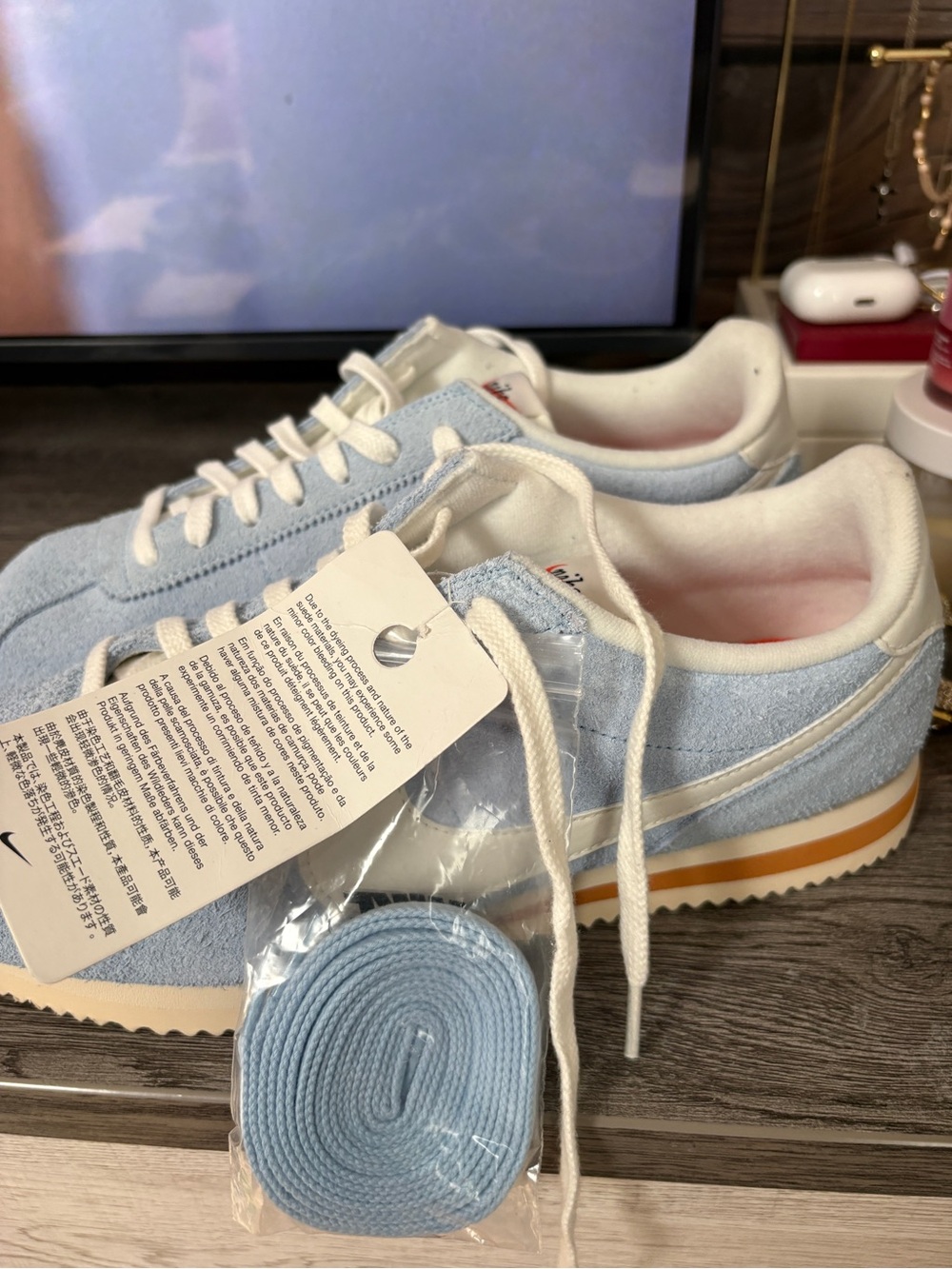 Nike White and Light Blue Suede Low-Top Sneakers with Orange Accent - Picture 2 of 4